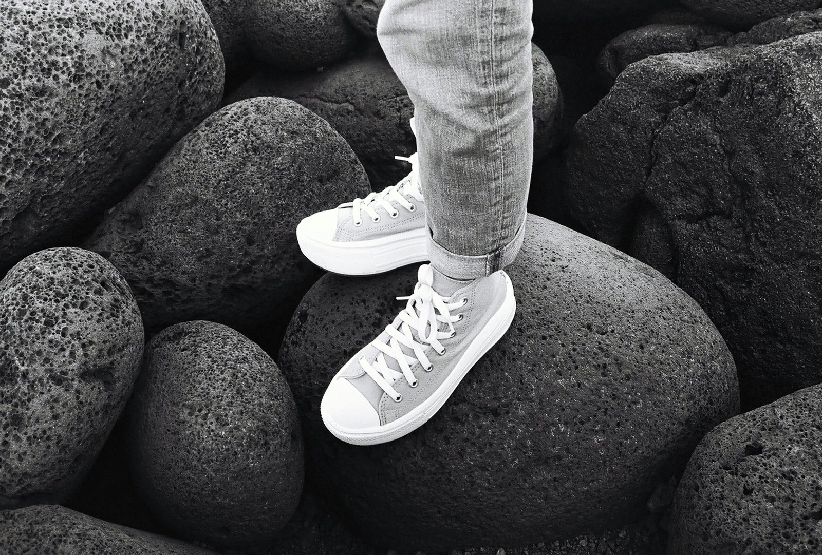 a person standing on top of a pile of rocks